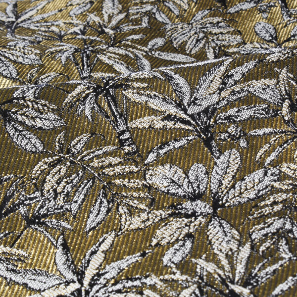 Jacquard tissé dans le bassin lyonnais. Motif feuillages dans des coloris or